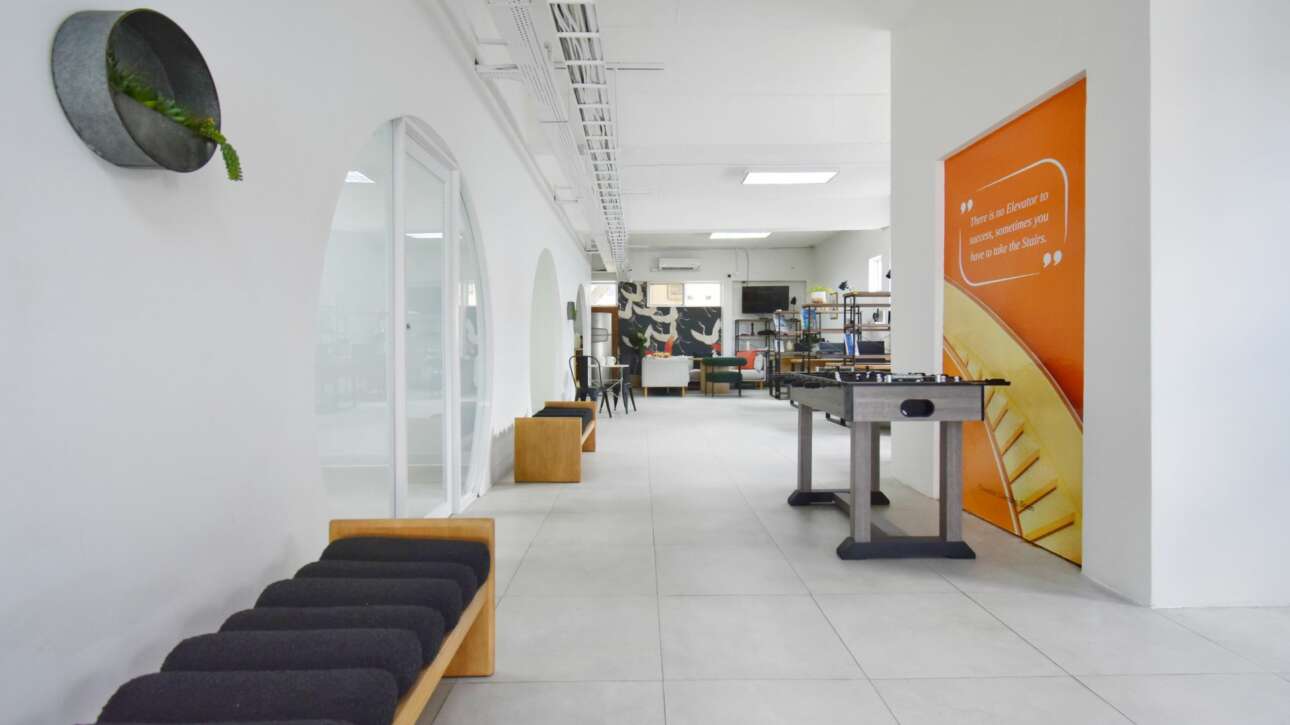 The Ground Floor is designed with a mixture of retail spaces with unique round entrance doors on the left, leading to the Hotdesk area on the right