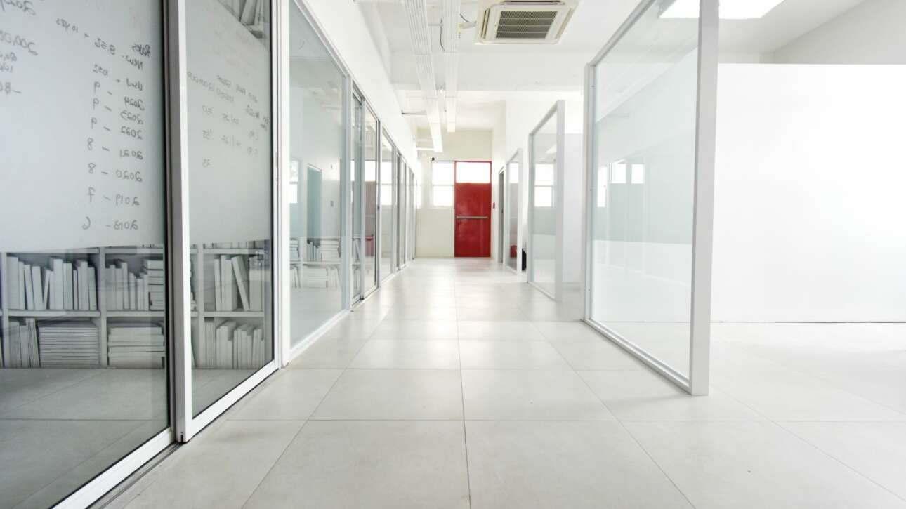 Offices flank both sides of the 90ft 1st floor corridor, but clever design elements maintain a bright and airy feel.