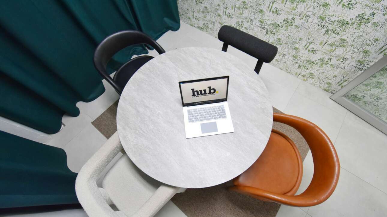 The first floor meeting room includes sound absorbent velvet curtain panels, upholstered seating and an outdoor inspired wall paper and was designed for small meetings and podcasts