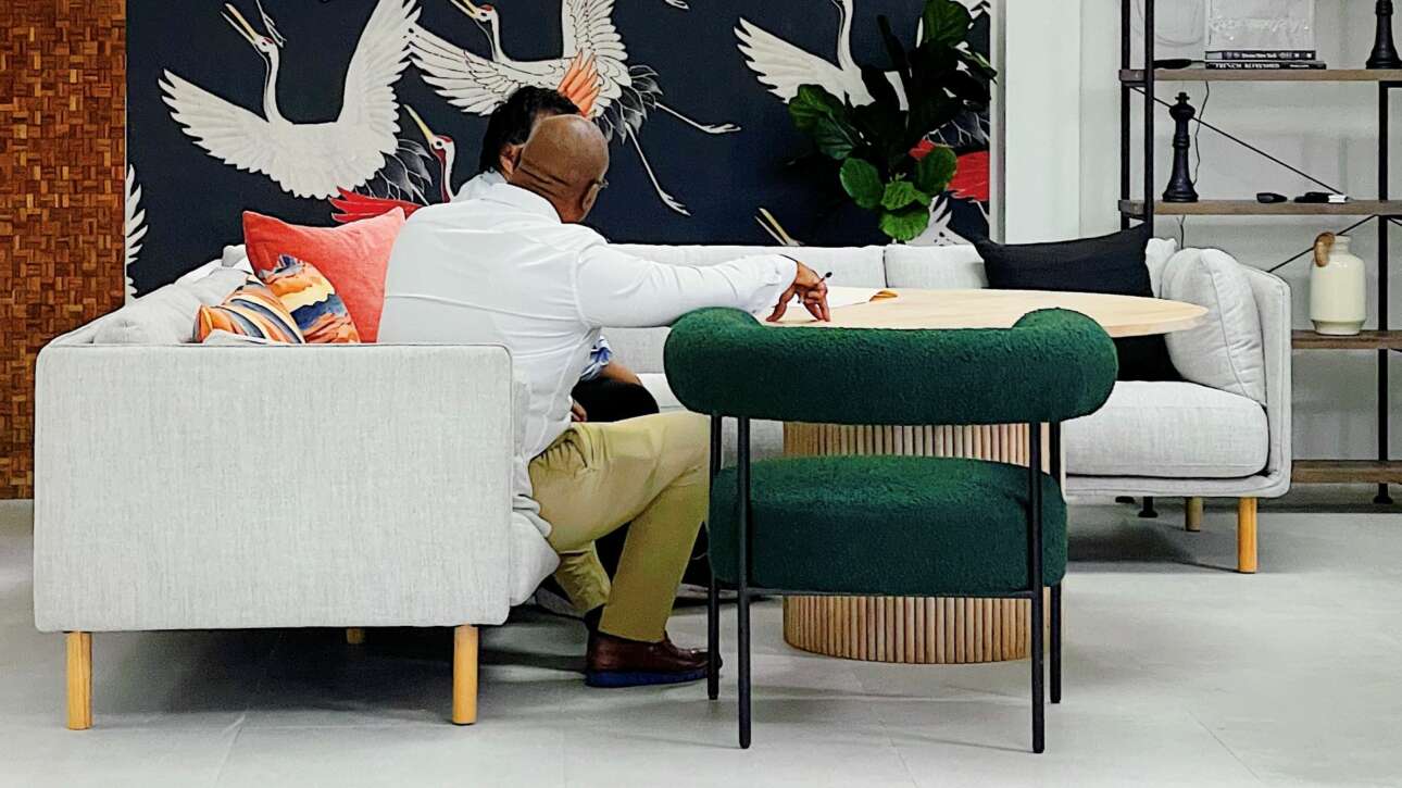 An L shaped sectional and boucle accent chair create the perfect opportunity for a casual meeting